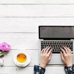 A calming picture of a computer and tea to represent the peace that can come from hiring a SEO specialist to help your private practice website rank better.