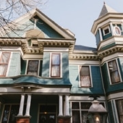 Photo of the front of the house representing how a website's home page is similar to a front door as both serve as an introduction to what's inside.
