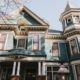 Photo of the front of the house representing how a website's home page is similar to a front door as both serve as an introduction to what's inside.