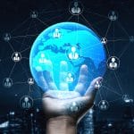 Photo of a hand holding a globe with connections to show the importance of backlinks to connect sites to one another and improve rankings on Google.