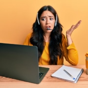 Shows a confused woman at a computer. Represents how duplicate content can affect SEO negatively