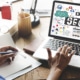 A close-up of a woman typing with an SEO graphic on her laptop. This represents support for local SEO for therapists. Contact Simplified SEO Consulting to learn more about how we can support your private practice website today!