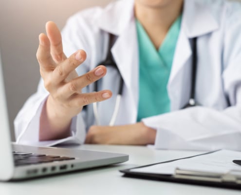 A functional medicine doctor speaking on the computer. Want to learn more about SEO in healthcare? Our services can provide the knowledge needed to help functional medicine doctors understand SEO.