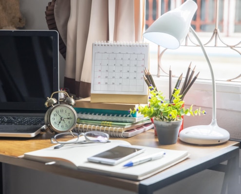 Image of a desk full of notebooks and a computer. Do you think you need an SEO tune up? Read more for tips on when and how to do them. We provide SEO for therapists and SEO for mental health professionals. Call today to schedule SEO services consulting.