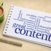 Photo of a notebook with a word cloud related to content representing the importance of writing blog posts and service pages on a mental health website that provide value for counseling and therapy clients.