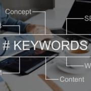 Image of someone working on a laptop with the word keyword. Discover how you can find your ideal clients with the help of keyword research.