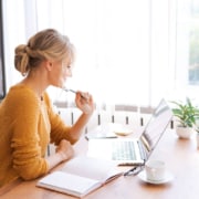 Shows a therapist thinking. Represents how writing blogs and service pages for your private practice website can help your SEO today!