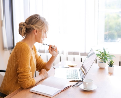 Shows a therapist thinking. Represents how writing blogs and service pages for your private practice website can help your SEO today!