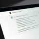 Shows ChatGPT up on the screen. Represents how AI tools can be used for seo for mental health and its copywriting.