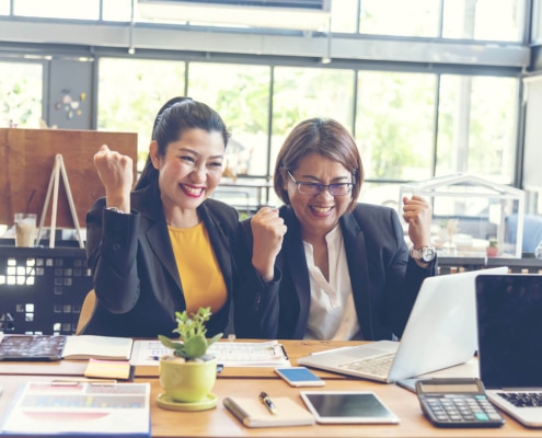 Shows two therapist excited for Simplified SEO Consulting's new package. Represents how seo for mental health is beneficial for private practices.