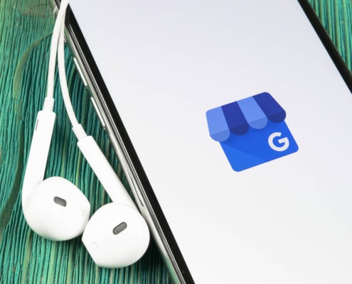A close up of a phone screen with a Google Business Profile logo. Learn how to use your Google Business Profile in counseling and the support we can offer for private practice SEO.