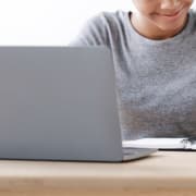 Shows a person smiling about ChatGPT. Represents how ChatGPT is beneficial for seo for private practices.