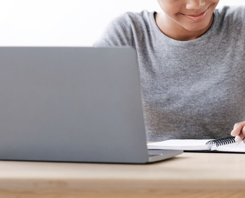 Shows a person smiling about ChatGPT. Represents how ChatGPT is beneficial for seo for private practices.