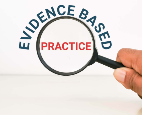 A hand holds a magnifying glass over words. Want to understand what makes healthcare SEO more effective? Our services can teach you the best healthcare SEO strategy.