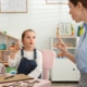 Photo of a private practice speech therapist helping a little girl.