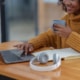 Image of a woman on the computer researching SEO for therapists. If you would like support in doing research for your business, reach out today!