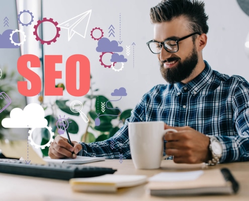 Photo of a man smiling and writing with the graphic word SEO beside him. Are you looking for SEO for private practices? Discover how to improve your website's SEO with the help of Simplified SEO Consulting.