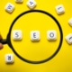 Photo of a magnifying glass hovering over the letters SEO. Are you looking to improve the SEO for your private practice? Learn tips and tricks to helping your SEO here.