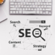 The words SEO on a table with a laptop on it. Don't know what SEO is and how Local SEO for doctors can help your practice? We work to help people understand SEO in healthcare.