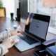 Close-up of hands typing on a laptop, representing the search for therapist directories. Learn more about the best therapist directories by searching for "therapist directory" today.