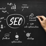Photo of someone writing down SEO tips on a chalkboard. With the help of Simplified SEO you can begin learning to maintain your SEO and rank on search engines.