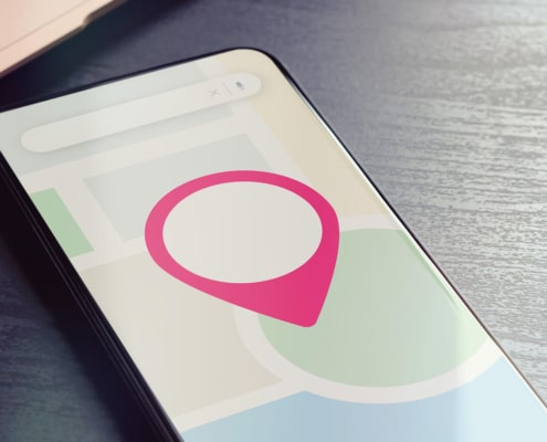 Shows a location indicator on a phone. Represents how local seo for personal injury lawyers helps find ideal clients. Learn more about local SEO techniques here.