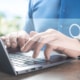 Photo of a man typing on a computer with the search bar showing. Learn to effectively create helpful content for your private practice SEO on your website with the help of readability!