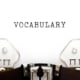A typewriter typing the word vocabulary. Learning SEO vocab can be a fun journey! Schedule a consultation with our SEO specialists today!