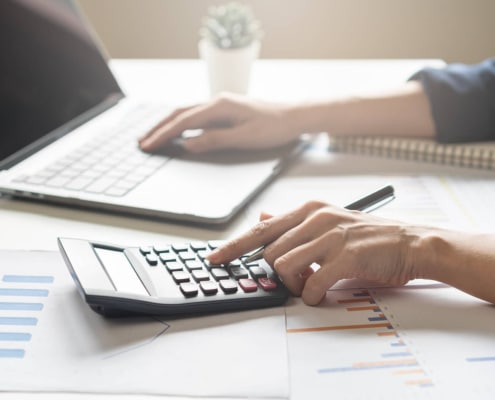An individual working on a budget for SEO marketing. Did you know we offer SEO for personal injury lawyers? Read on to learn how much you should be spending on SEO!