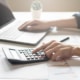 An individual working on a budget for SEO marketing. Did you know we offer SEO for personal injury lawyers? Read on to learn how much you should be spending on SEO!