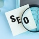 SEO typed on a sticky note. Learn how to advertise your therapy practice here! We have SEO techniques that can help.