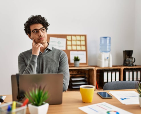 Shows a therapist thinking if hiring an SEO agency for private practice SEO is worth it. Represents how an agency can support you with seo for online therapy.