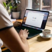 Image of an individual working on a laptop at a table. Discover how SEO can benefits therapists and how Simplified SEO Consulting can help you!