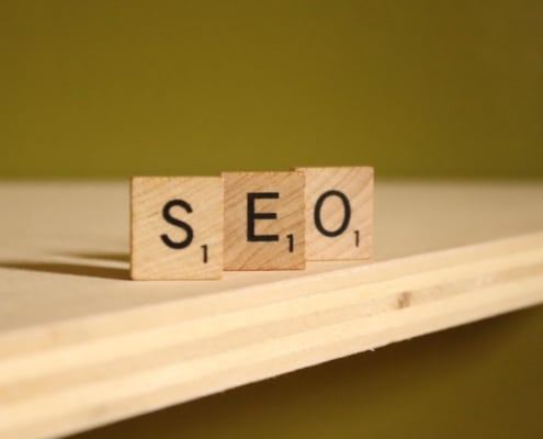 Image of wooden tiles spelling SEO. Discover the best way to advertise your law firm with the help of SEO.