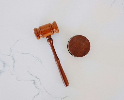 A wooden gavel on marble counter. Learn more about local SEO for personal injury lawyers here. We are ready to help you rank higher on Google!