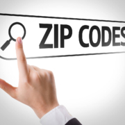 Image of a finger pointing at a digital image reading zip codes. Discover how important zip codes can be in your SEO when it comes to finding your ideal clients.