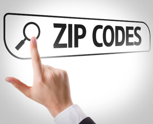 Image of a finger pointing at a digital image reading zip codes. Discover how important zip codes can be in your SEO when it comes to finding your ideal clients.