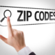 Image of a finger pointing at a digital image reading zip codes. Discover how important zip codes can be in your SEO when it comes to finding your ideal clients.