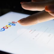 Image of a woman typing on her cell phone clicking on Google. Begin finding your ideal clients with the support of Simplified SEO Consulting.